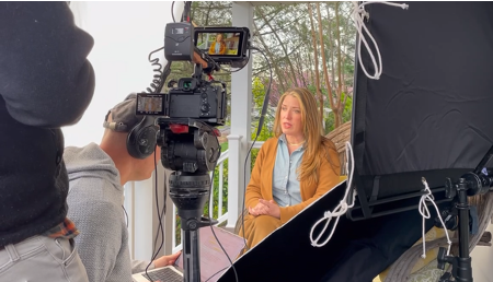 Loretta Markevics being filmed for an on-camera interview about The Farmers Finds